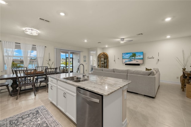 kitchen featuring sink, white cabinetry, a center island with sink, dishwasher, and light stone countertops