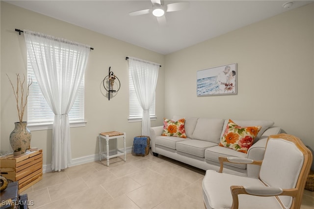 living room featuring ceiling fan and light tile patterned flooring