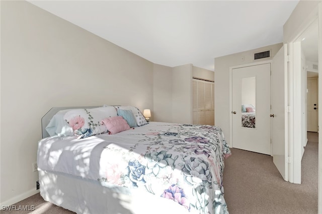 carpeted bedroom featuring a closet