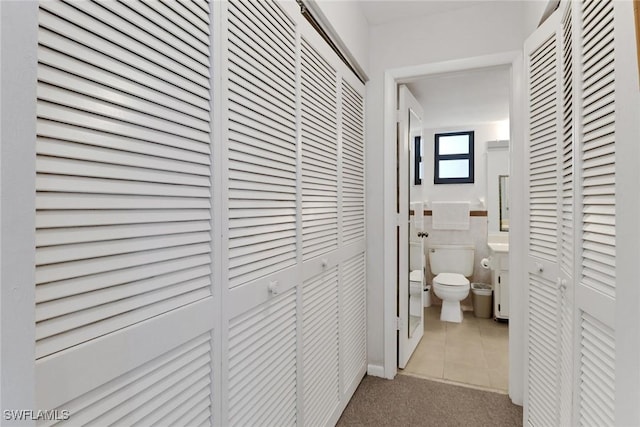 bathroom with tile patterned floors and toilet