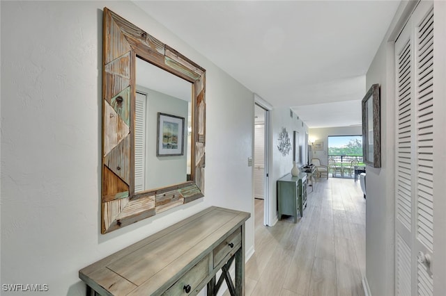 hallway featuring light hardwood / wood-style flooring