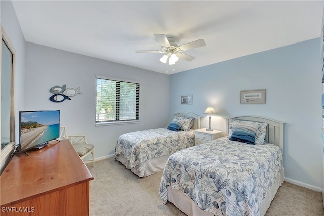 bedroom with light colored carpet, a closet, and ceiling fan