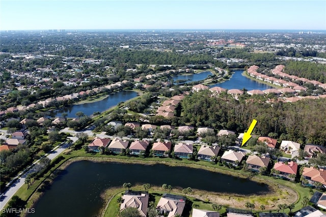 birds eye view of property featuring a water view