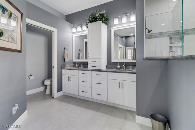 bathroom featuring a shower, toilet, and vanity