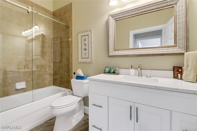 full bathroom with shower / bath combination with glass door, vanity, and toilet