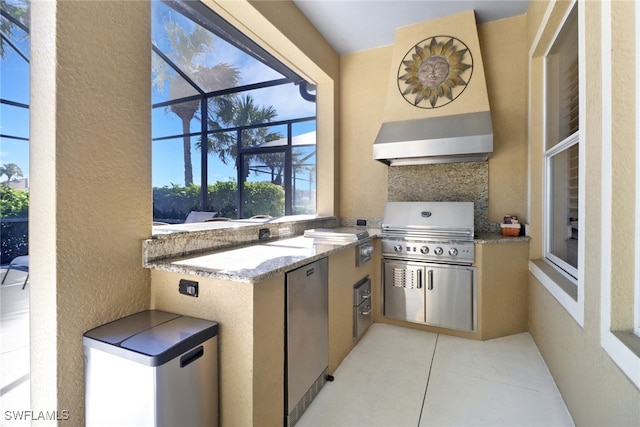 view of patio featuring glass enclosure, grilling area, and area for grilling