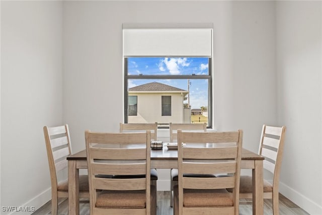 dining area featuring hardwood / wood-style flooring