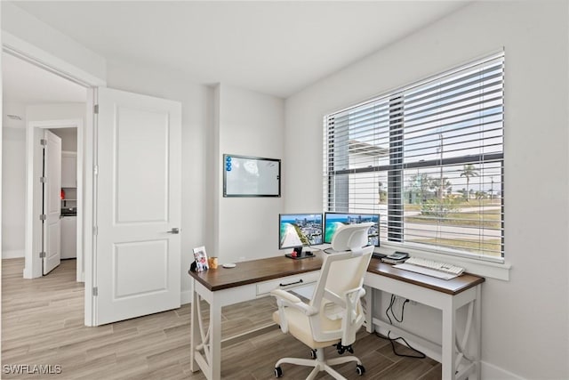 office space featuring light hardwood / wood-style floors