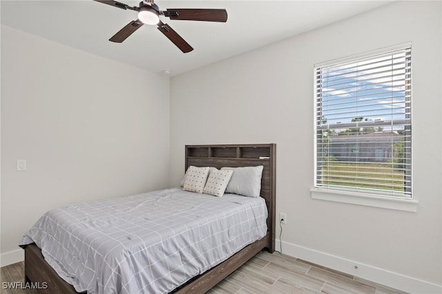 bedroom featuring ceiling fan and light hardwood / wood-style flooring