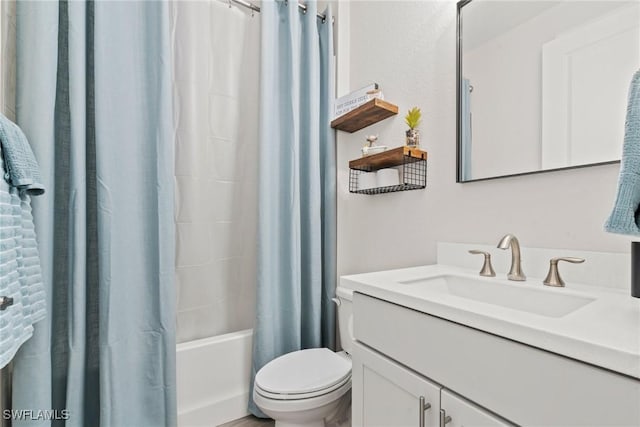 full bathroom with shower / bath combination with curtain, vanity, and toilet