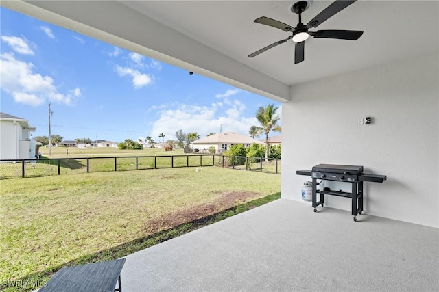 view of patio with a grill and ceiling fan