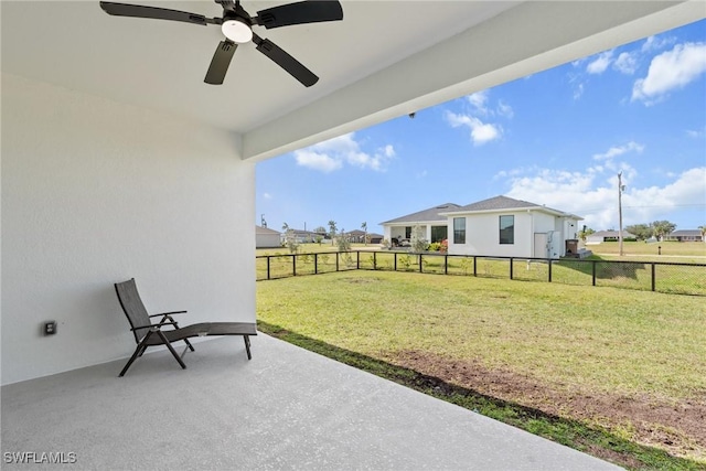 view of yard with a patio and ceiling fan