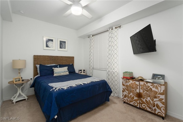 bedroom featuring ceiling fan and carpet