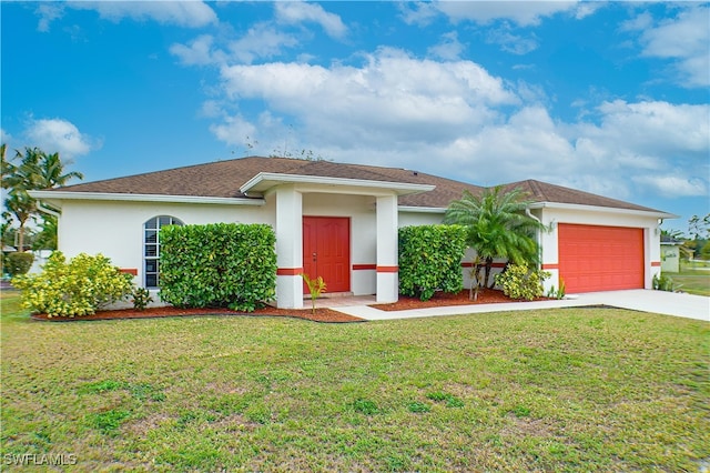 view of front facade with a front lawn and a garage