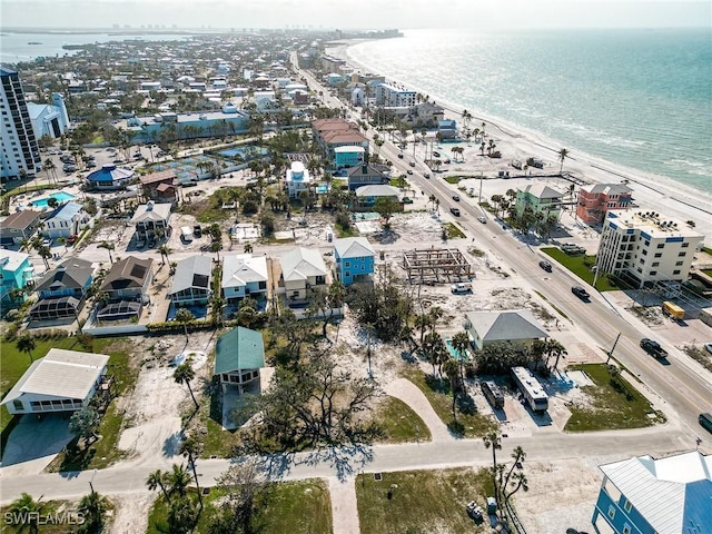 birds eye view of property featuring a water view and a view of the beach