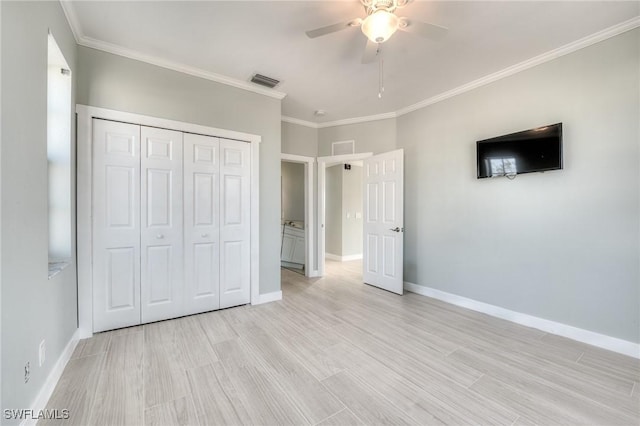 unfurnished bedroom featuring ornamental molding, a closet, ceiling fan, and light wood-type flooring