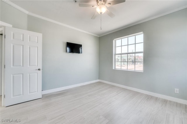 unfurnished room with crown molding, light hardwood / wood-style floors, and ceiling fan