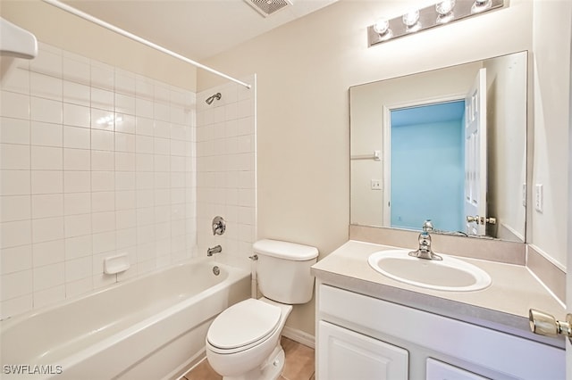 bathroom with visible vents, vanity, toilet, and tub / shower combination