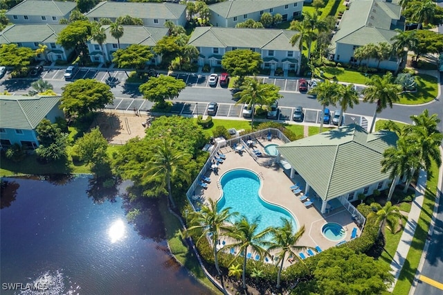 bird's eye view featuring a water view and a residential view