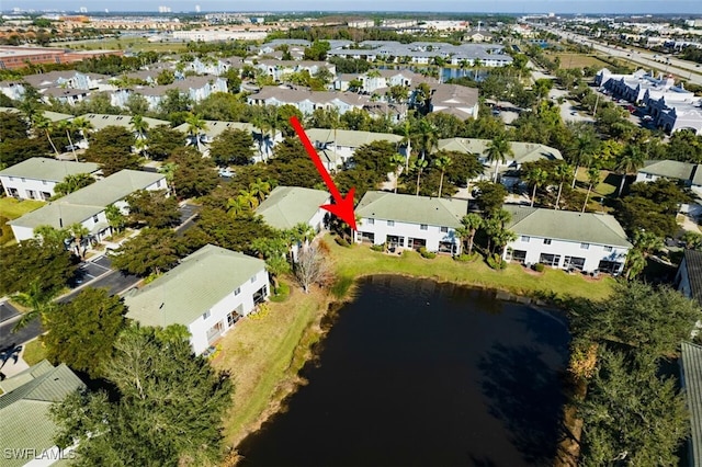 bird's eye view with a residential view and a water view