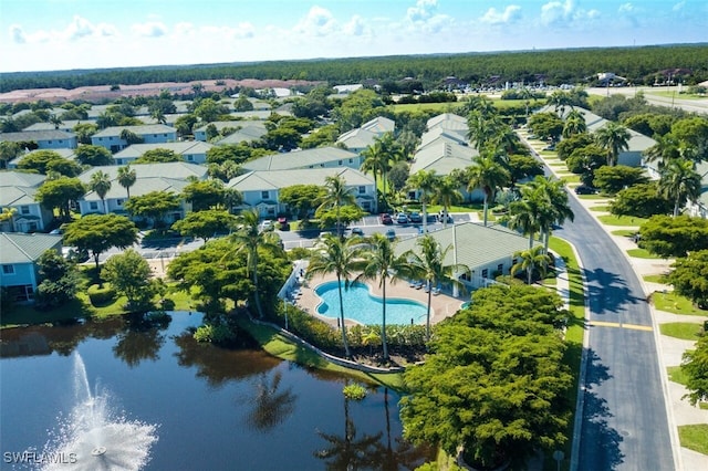 bird's eye view featuring a water view and a residential view