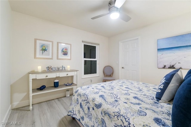 bedroom with light hardwood / wood-style floors and ceiling fan