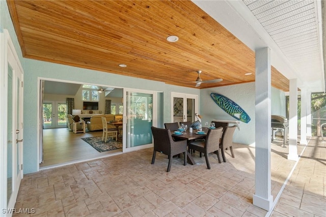 dining area with ornamental molding, wooden ceiling, ceiling fan, and french doors