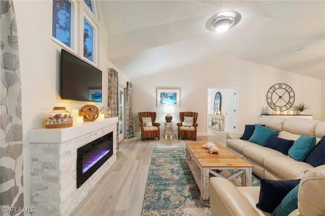 living room with lofted ceiling and light hardwood / wood-style floors