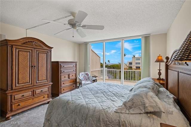 bedroom with a textured ceiling, light carpet, a ceiling fan, access to outside, and expansive windows