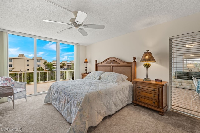 bedroom featuring light carpet, access to outside, floor to ceiling windows, and a ceiling fan