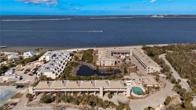 birds eye view of property with a water view and a residential view