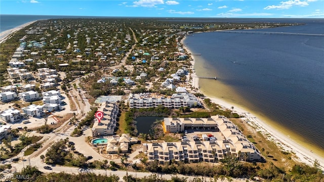 bird's eye view featuring a water view and a view of the beach