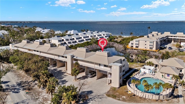 bird's eye view with a residential view and a water view