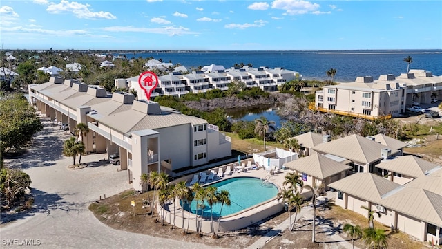 bird's eye view featuring a water view and a residential view