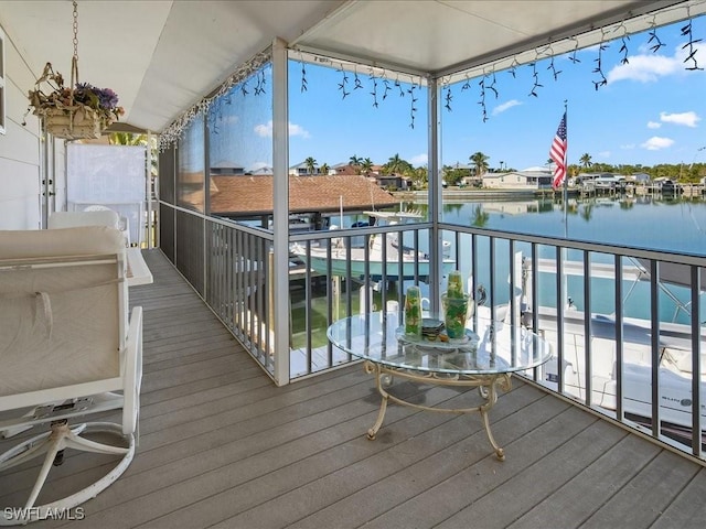 wooden terrace with a water view