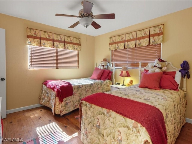 bedroom featuring hardwood / wood-style floors and ceiling fan