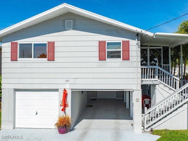 view of side of property with a garage
