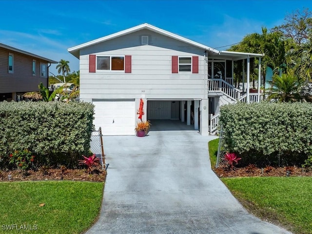 view of front of house featuring a garage and a porch