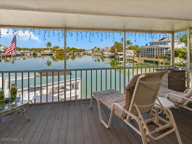 wooden deck featuring a water view