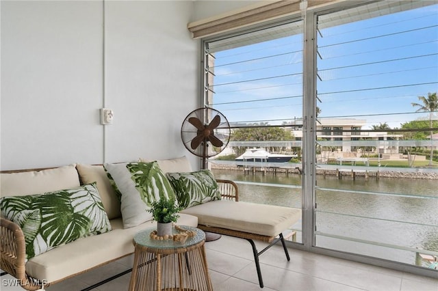 sunroom with a healthy amount of sunlight and a water view