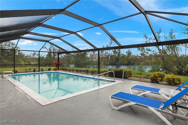 view of swimming pool featuring a water view, a patio area, and a lanai