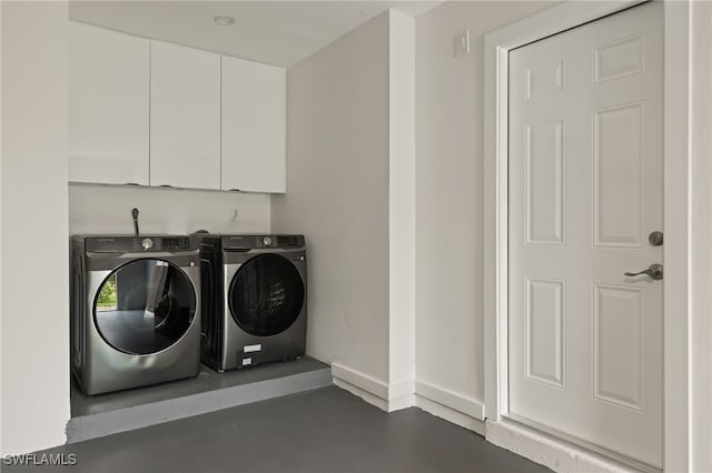 laundry room featuring separate washer and dryer