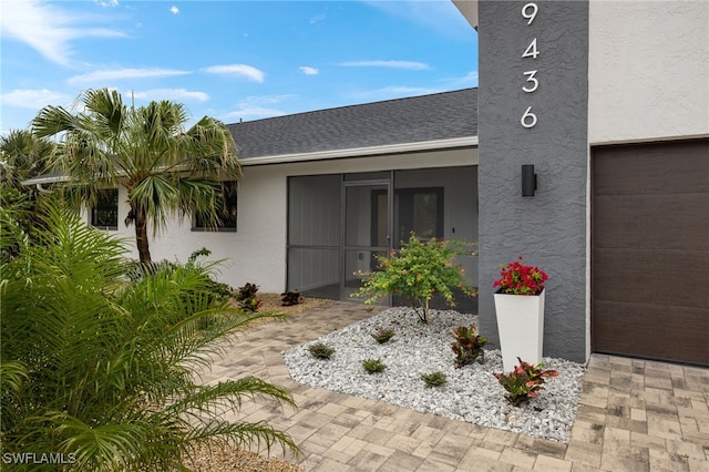 entrance to property featuring a garage