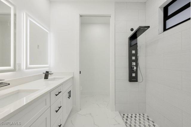 bathroom with vanity, toilet, and a tile shower