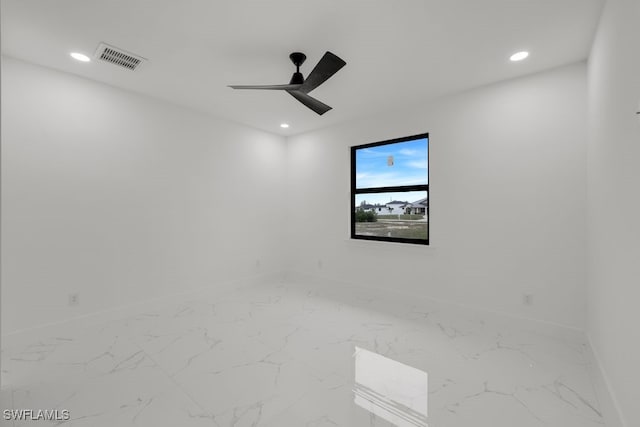 spare room with ceiling fan