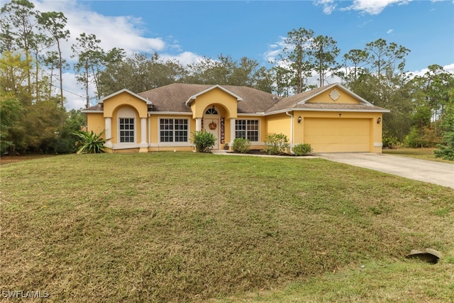 ranch-style home featuring a garage and a front yard