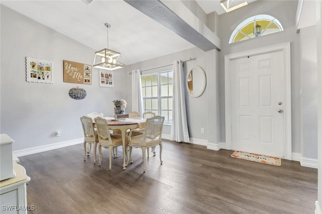 dining area with plenty of natural light, dark hardwood / wood-style flooring, and lofted ceiling