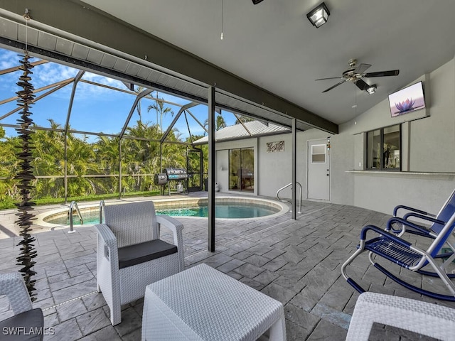 exterior space with ceiling fan and glass enclosure