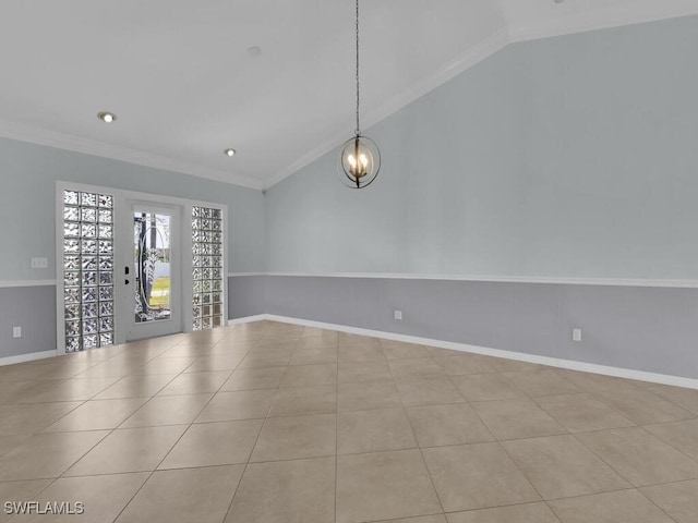 unfurnished room with vaulted ceiling, light tile patterned floors, ornamental molding, and a notable chandelier