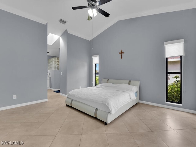 tiled bedroom featuring ceiling fan and lofted ceiling